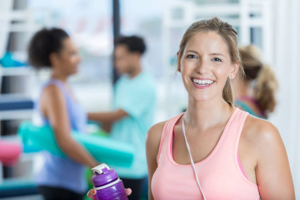 istock Healthy mid adult woman cools down after work out 832445598