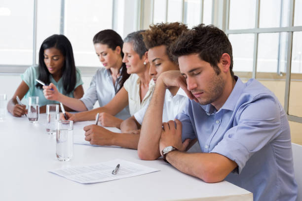 istock Casual businessman falling asleep during meeting 832494328