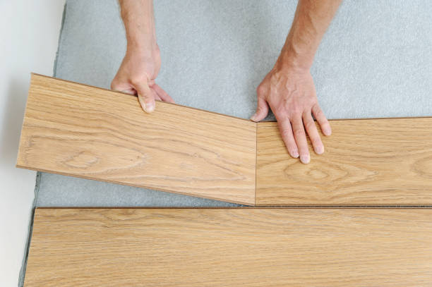 istock Installation of a laminate floorboard. 832498758