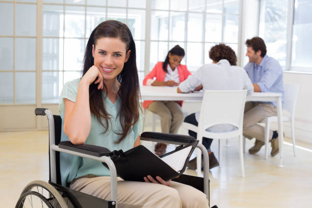 istock Attractive disabled businesswoman at work 832503550
