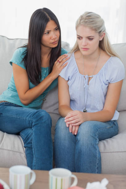 istock Friend comforting her upset friend 832507984