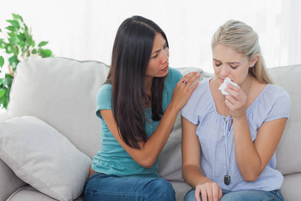 istock Concerned woman comforting her crying friend 832508094