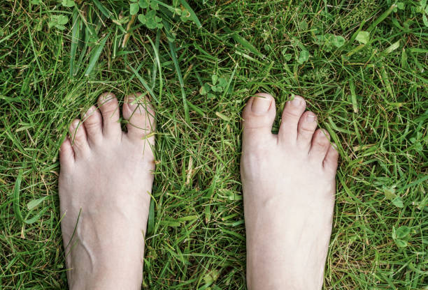 istock feet of a woman on grass 832508568