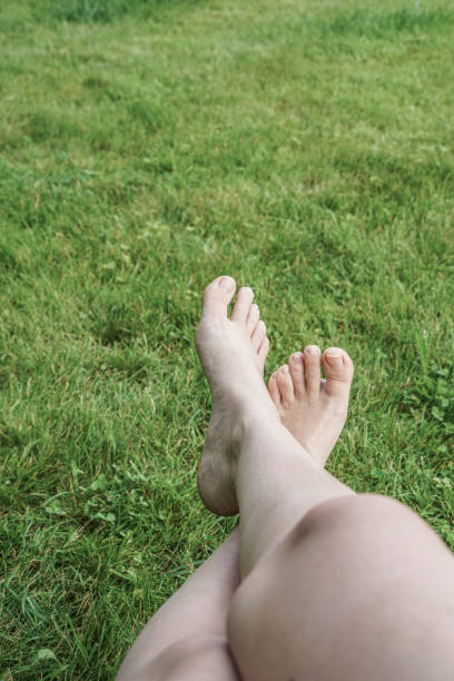 istock feet of a woman on grass 832508576