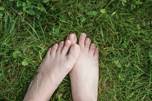 istock feet of a woman on grass 832508582