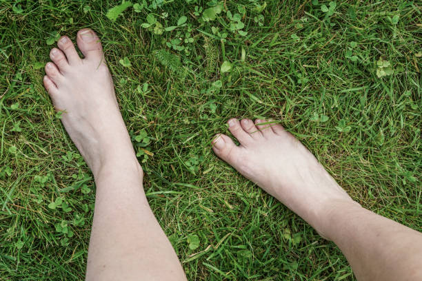 istock feet of a woman on grass 832508718