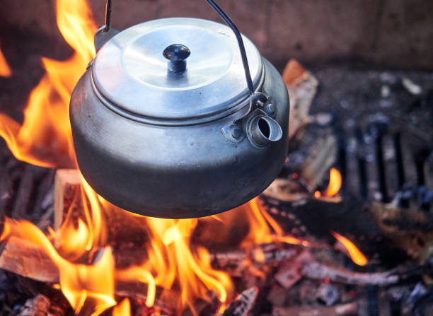 istock Metallic coffee pot in campfire heat 832509378