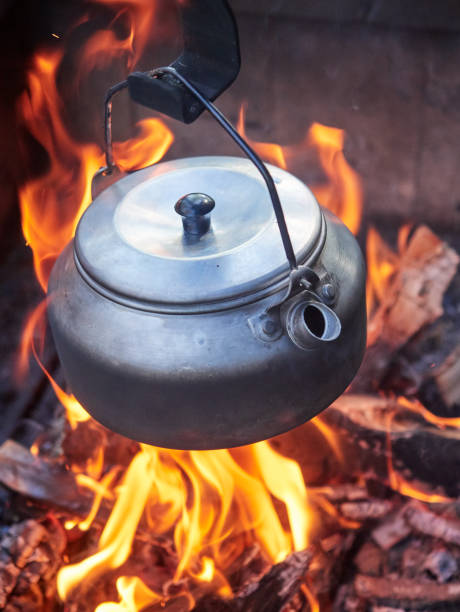 istock Metallic coffee pot in campfire heat 832509694
