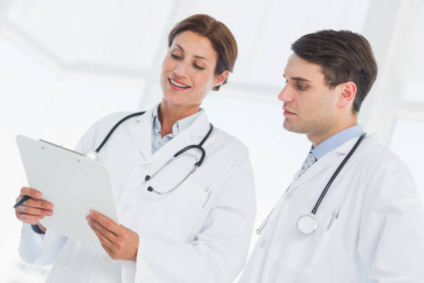 istock Doctors looking at report in hospital 832512982