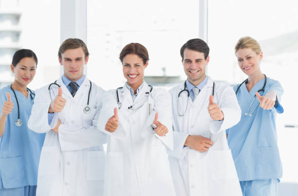 istock Doctors gesturing thumbs up at hospital 832513504