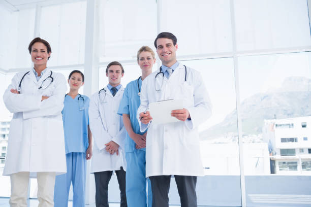 istock Young doctors standing together at hospital 832513586