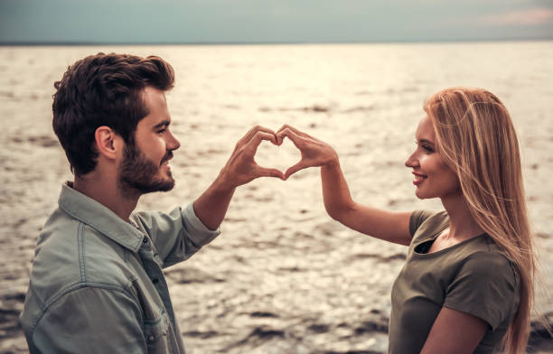 istock Couple walking at the sea 832514850