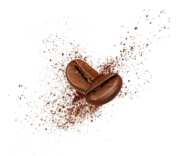istock Two coffee beans collide in the air on white background 832531288