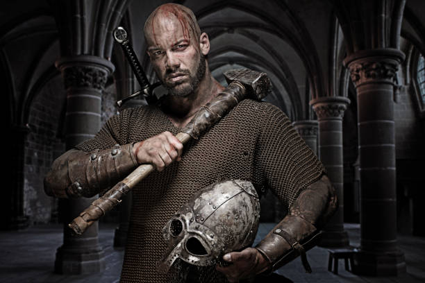 istock Weapon wielding bloody viking warrior in emotional pose 832531344