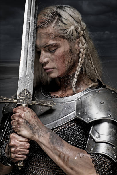 istock Beautiful Blonde Sword wielding viking warrior female 832533890