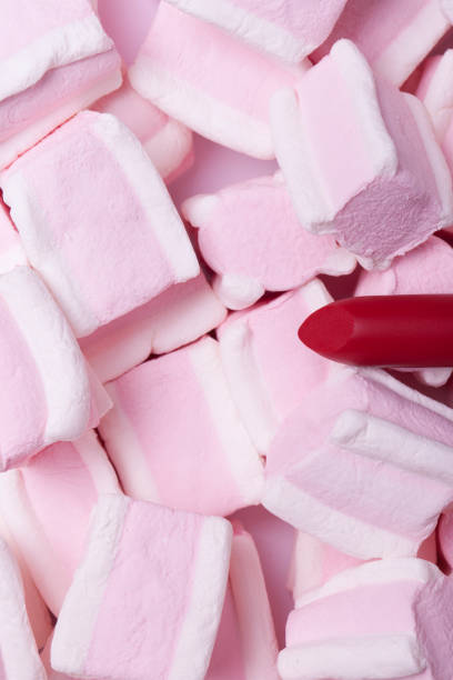istock Red lipstick on a background of sweets 832551856