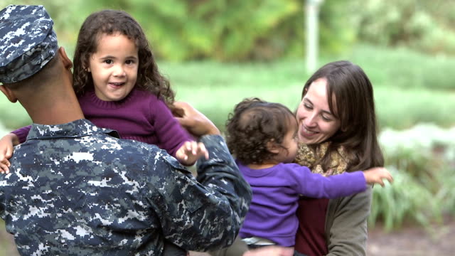Military homecoming, navy man greets family