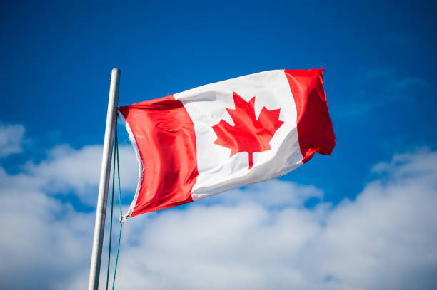 istock Canadian flag flying in the breeze 832565190