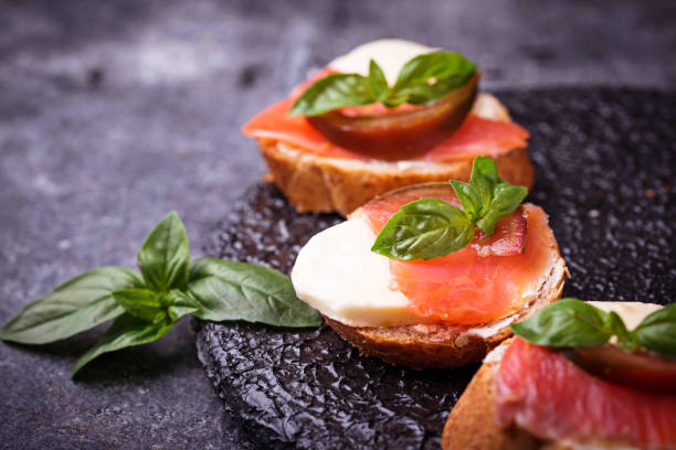istock Crostini with salmon, mozarella, tomato and basil 832566858