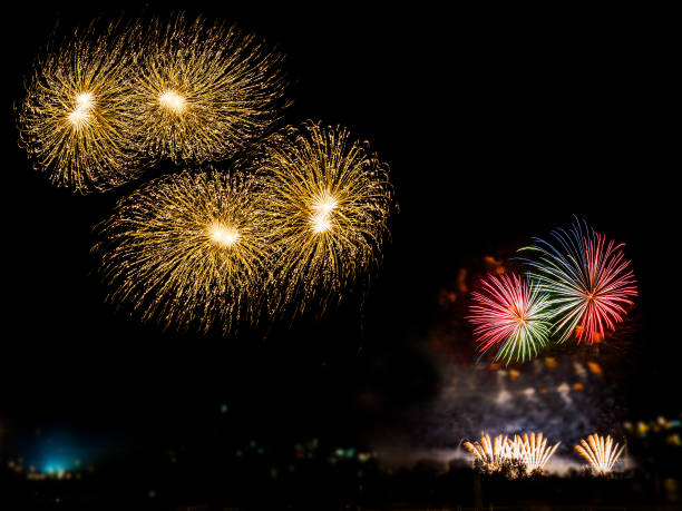 istock Colorful fireworks with multiple bursts against dark sky 832586292