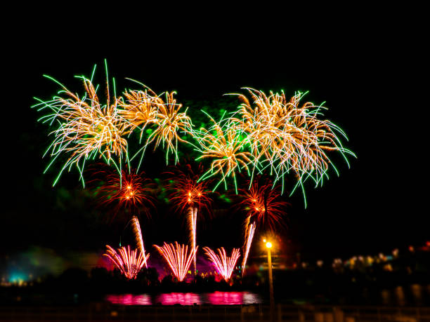 istock Colorful fireworks with multiple bursts against dark sky 832586408