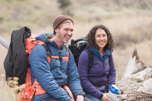 istock Two friends take a break from backpacking to admire the scenery 832598134