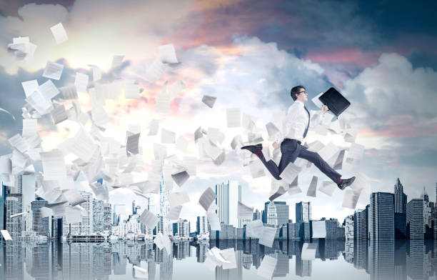 istock Businessman jumping over a chasm in a city, toned 832600166