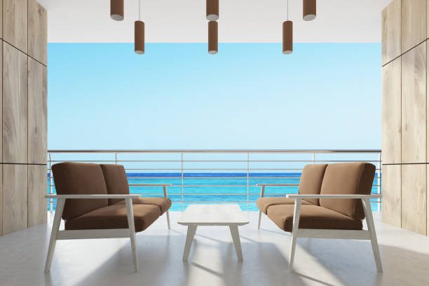 istock Wooden balcony, brown armchairs 832610316