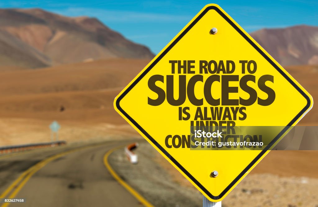 The Road to Success is Always Under Construction The Road to Success is Always Under Construction road sign Success Stock Photo
