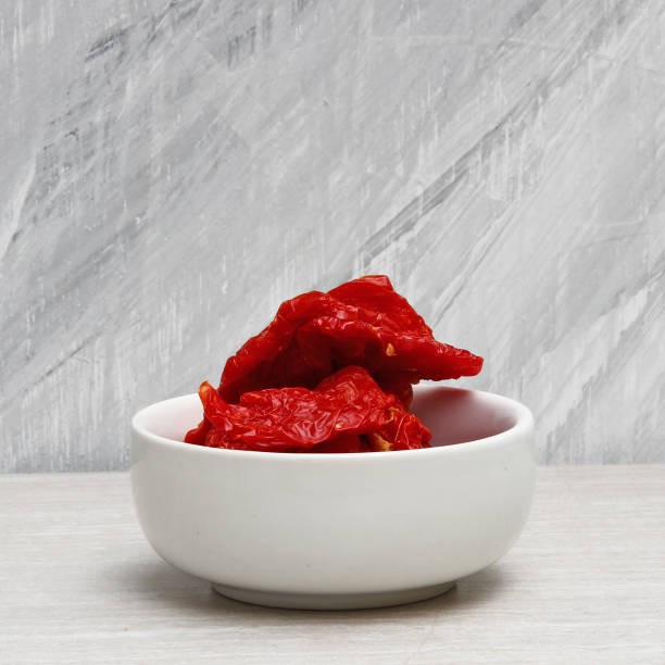 istock Sun dried Tomatoes on a stone background 832646184