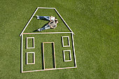 Couple laying inside house outline