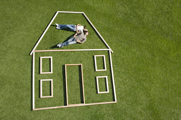 Couple laying inside house outline  day dreaming stock pictures, royalty-free photos & images