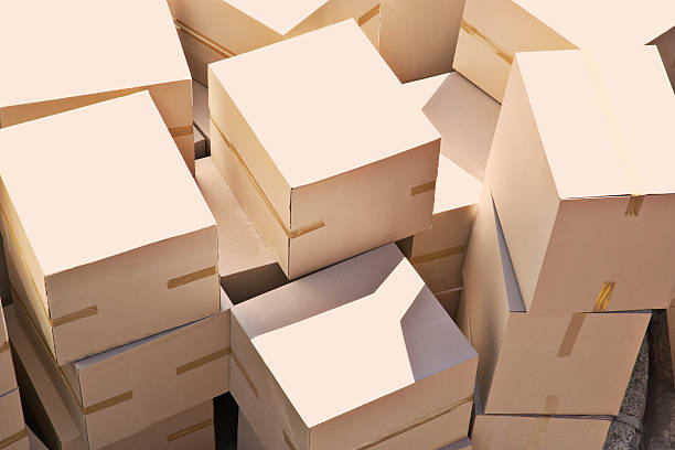 Large group of stacked boxes  cardboard box stock pictures, royalty-free photos & images