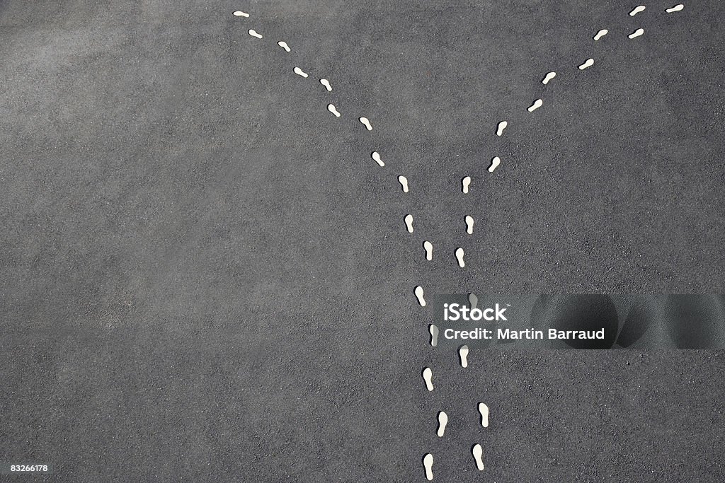 Diverging line of footprints - Royalty-free Scheiding - Begrippen Stockfoto