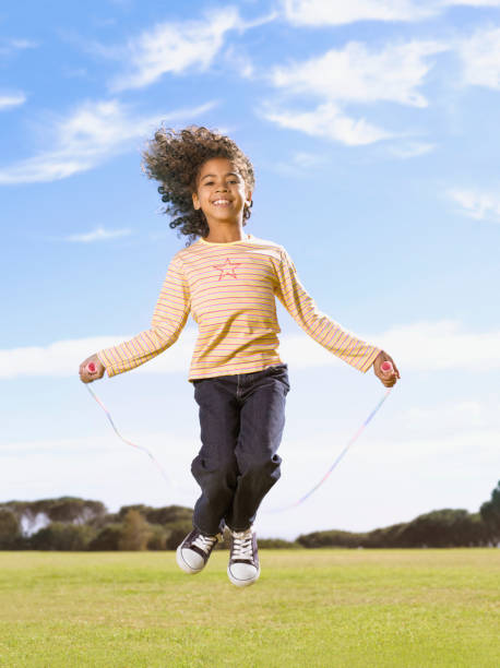 Young girl jumping rope  skipping stock pictures, royalty-free photos & images