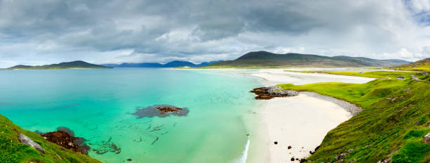 istock Panoramic view of Luskentyre white beaches under dramatic sky 832667308