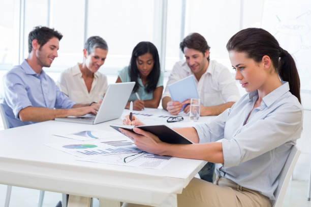 istock Attractive business people working in the office 832677448