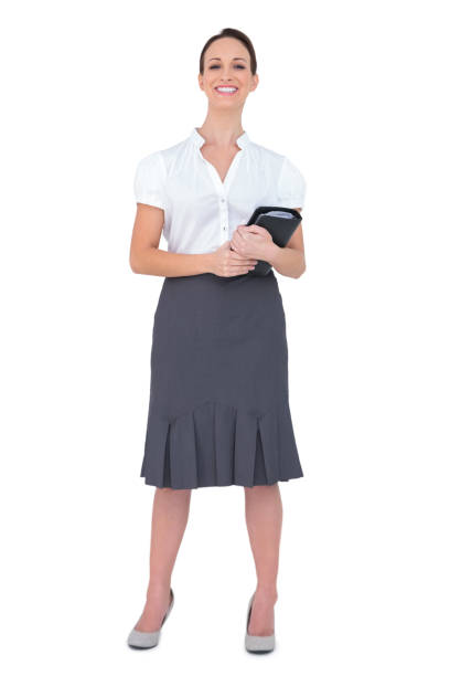 istock Cheerful businesswoman holding datebook 832713528