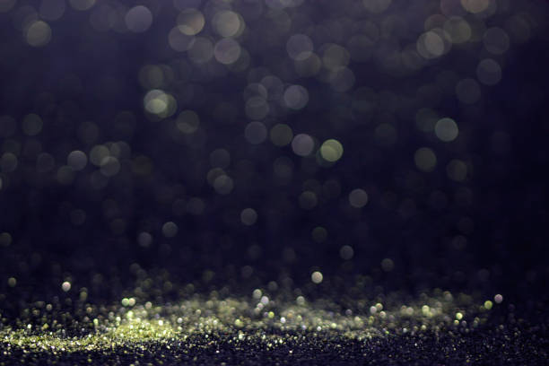 istock Bokeh glitter fly and lights on black 832718132