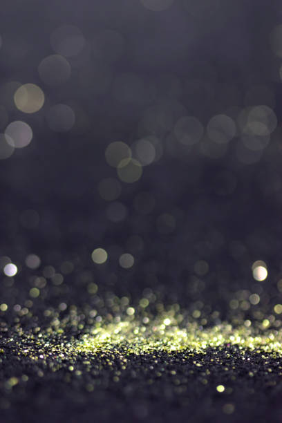 istock Bokeh glitter fly and lights on black 832737090