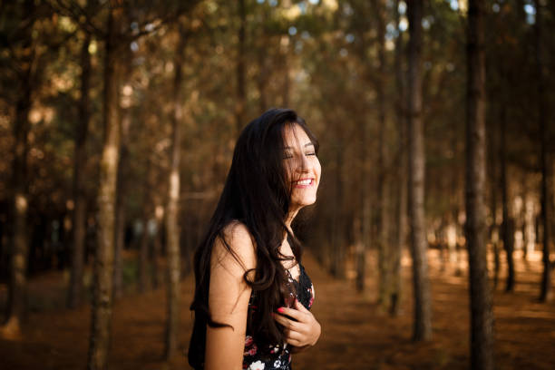 istock Girl laughing in the woods. 832795244