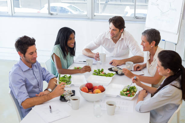 istock Business people eating lunch together 832820216
