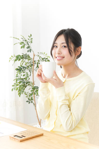 istock Woman drinking coffee at office 832820278