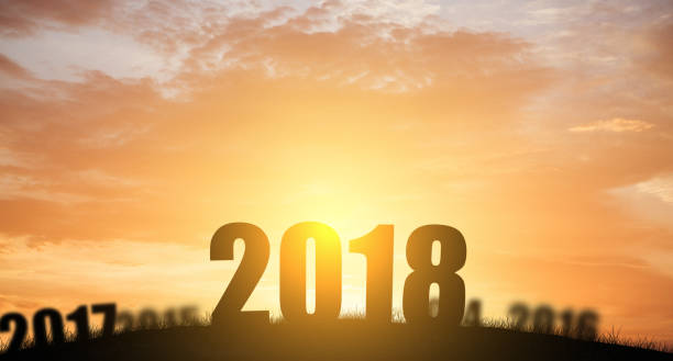 istock New year 2018 silhouette with sun light 832826388