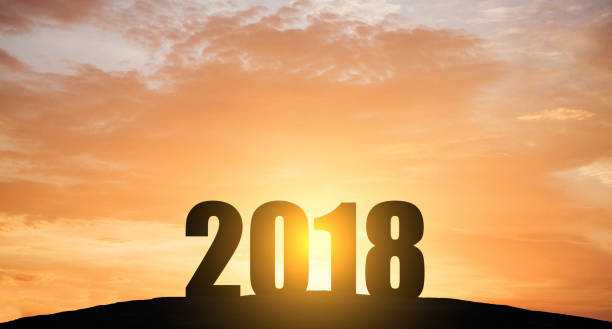 istock New year 2018 silhouette with sun light 832833798