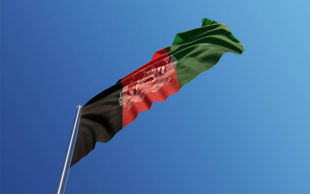 青い空に風と手を振っているアフガニスタン国旗 - flag of afghanistan ストックフォトと画像