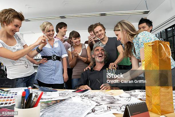 Colleagues Celebrating The Birthday Of Their Boss Stock Photo - Download Image Now - Birthday, Office, Humor