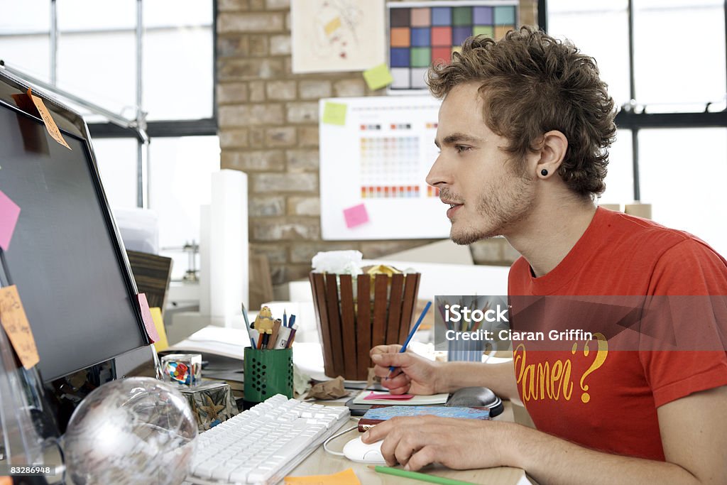 Designer focusing on his work on the computer  20-24 Years Stock Photo