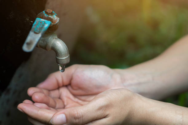 istock Women use hand the water frame to drink ,Water shortage concept. 832872818