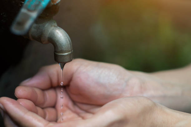 istock Women use hand the water frame to drink ,Water shortage concept. 832873170